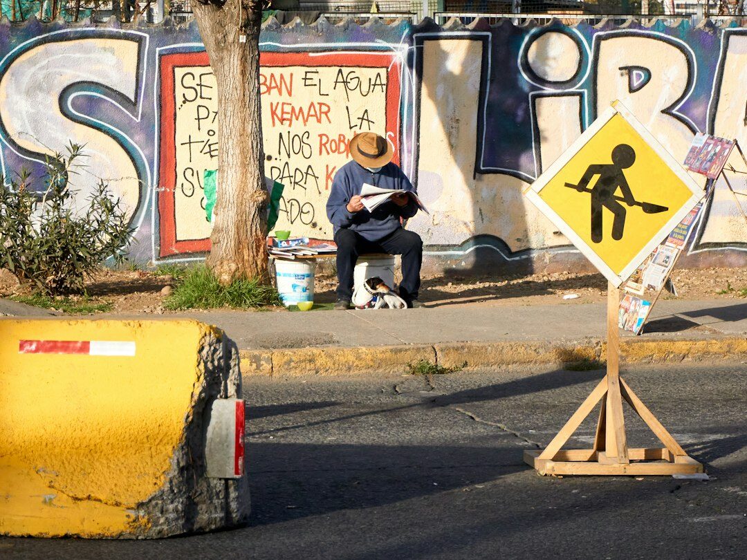 Chilean journalist writing field notes on a city street