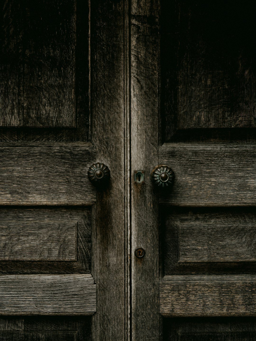Detail of a weathered wooden door in an old Chilean building